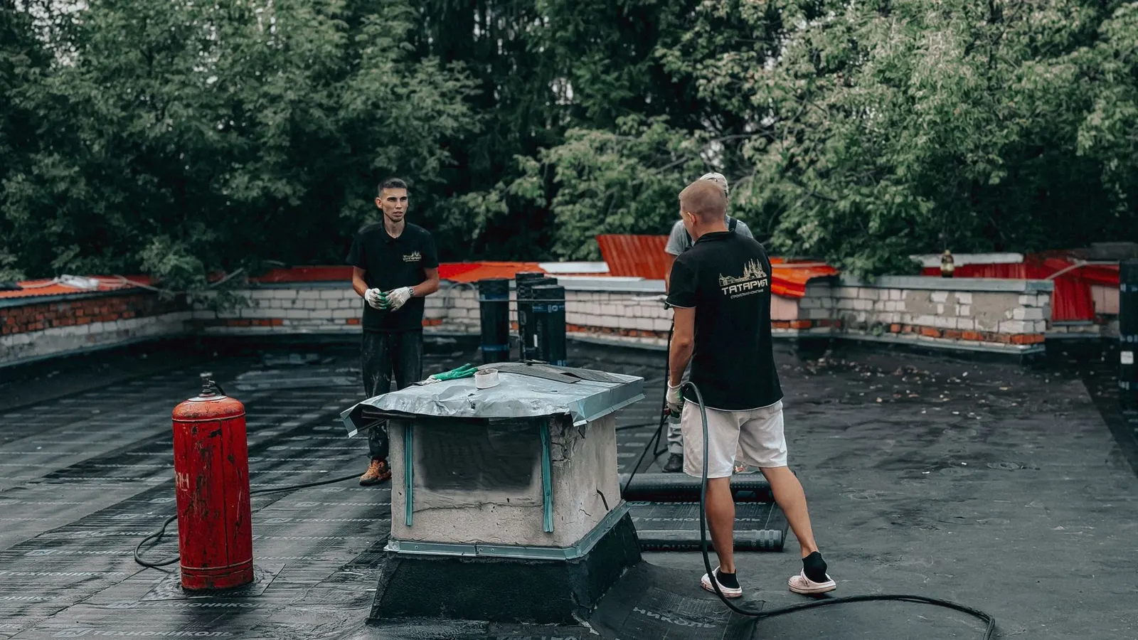 Roof repair contractor working on a Des Moines home